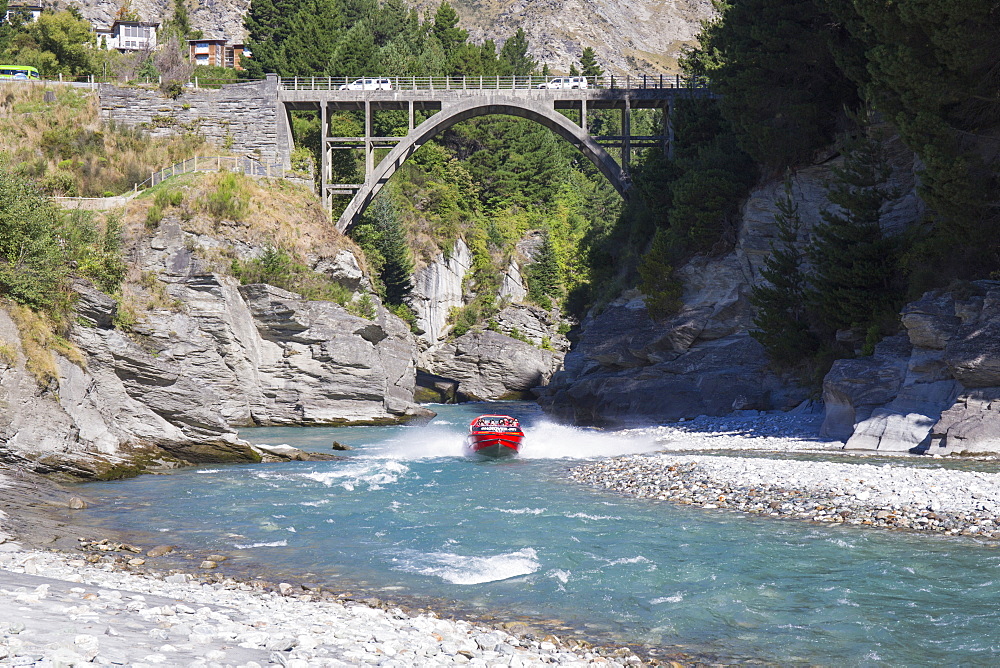 Jet boat on the Shotover River below the Edith Cavell Bridge, Queenstown, Queenstown-Lakes district, Otago, South Island, New Zealand, Pacific