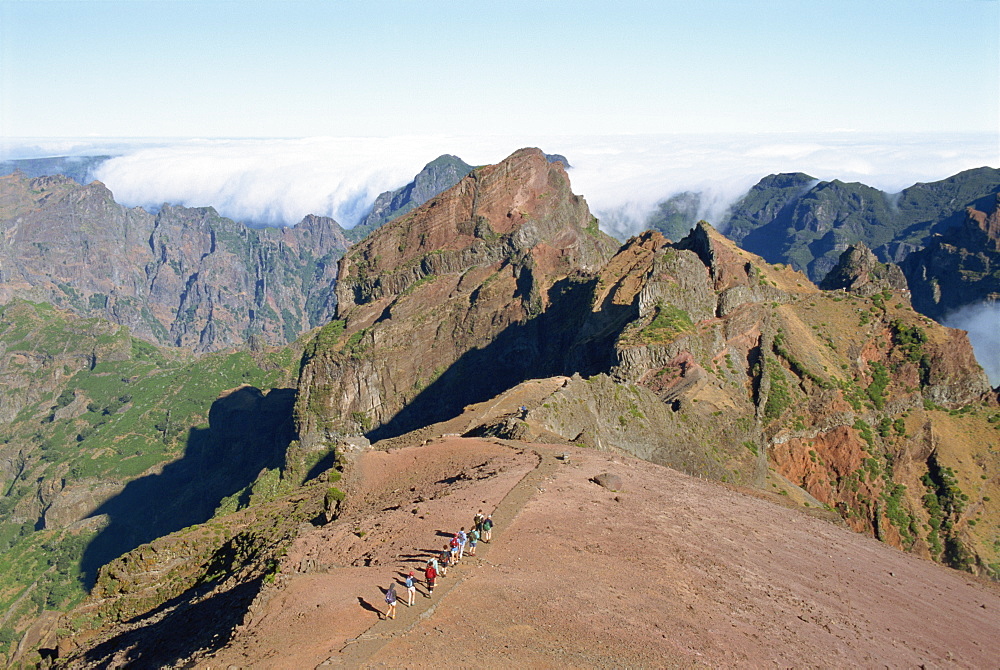 Tourists walking in the mountains in the Pico do Arieiro, Madeira, Portugal, Europe