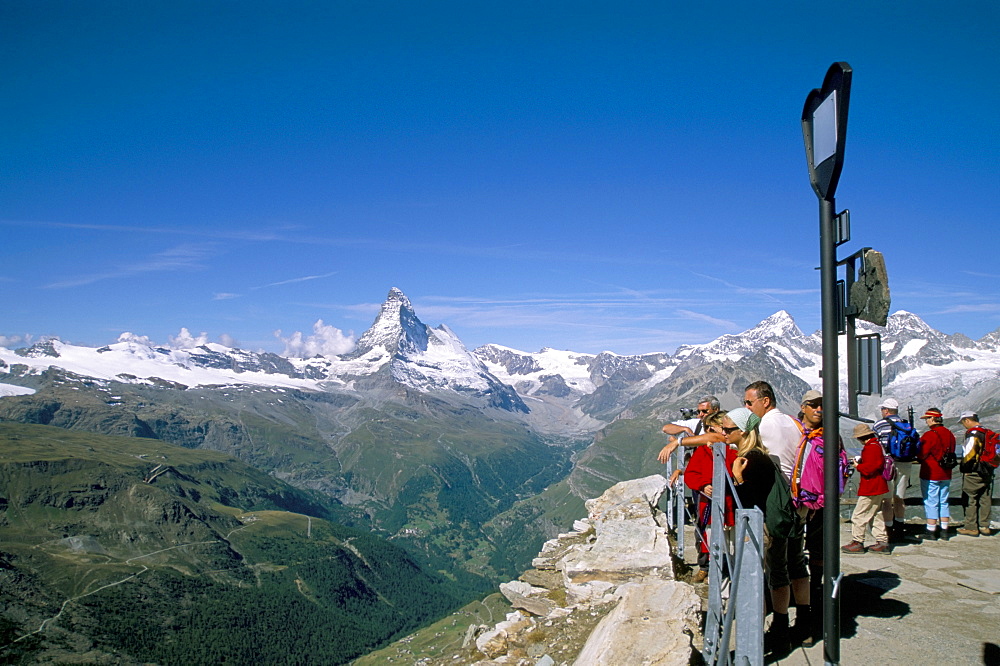 Tourists looking at view from Rothorn to Matterhorn, Valais, Swiss Alps, Switzerland, Europe