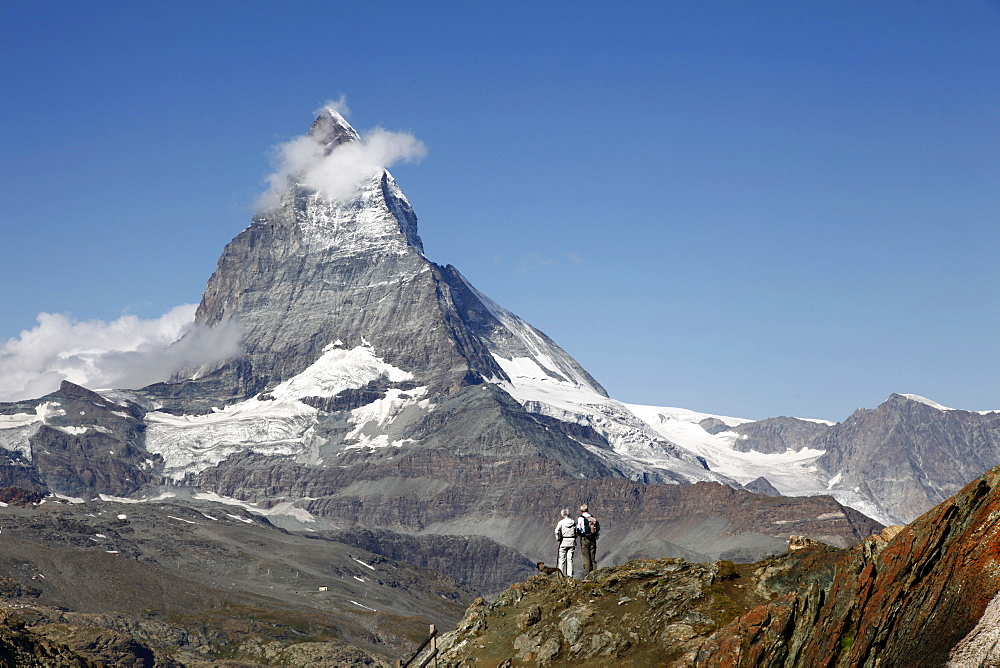 Two hikers in front of the Matterhorn, Gornergrat, Zermatt, Valais, Swiss Alps, Switzerland, Europe