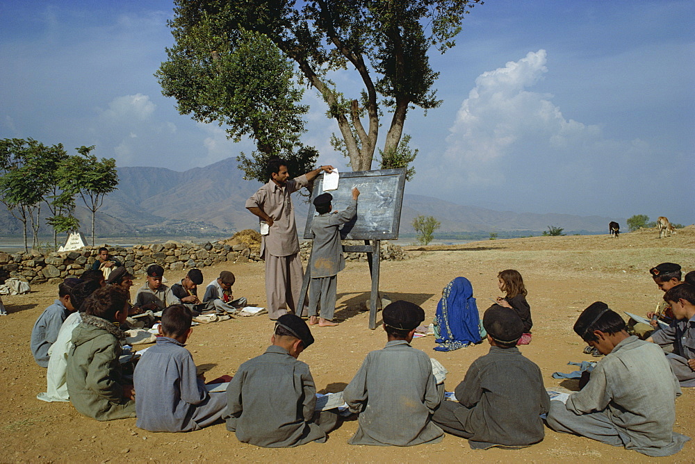 Two school girls separated from the boys at a village school in the Swat valley, Pakistan, Asia