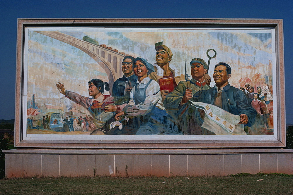 Photograph taken in the 1960s of a billboard showing the four modernizations, represented by farmer, scientist, industrial worker holding complete works of Mao and soldier, Shaoshan, Hunan, China, Asia