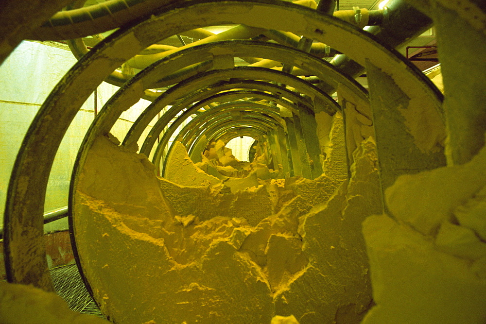 Yellow cake, powdery uranium oxide in Burwell filter press, Uranium City, Saskatchewan, Canada, North America