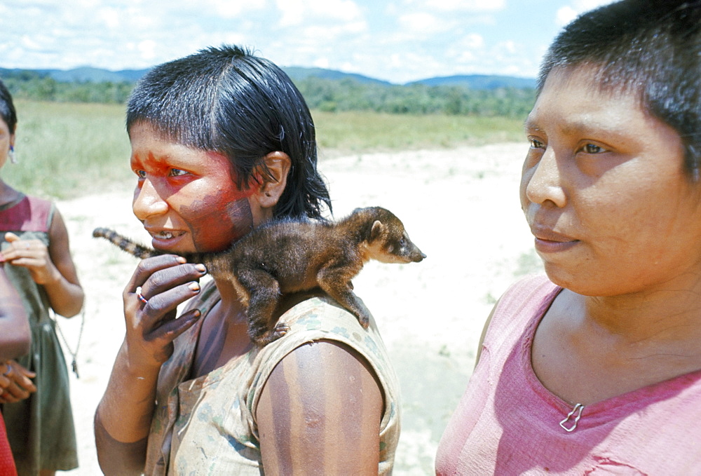 Gorotire Indian girl with pet coati, Xingu, Brazil, South America