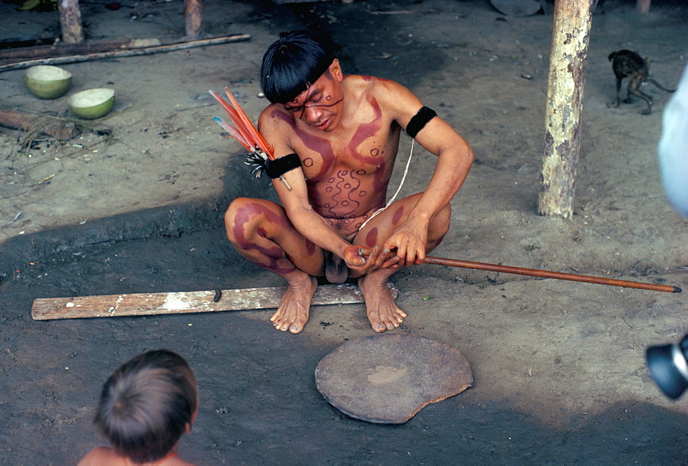 Yanomami man preparing hallucinogenic snuff, Brazil, South America