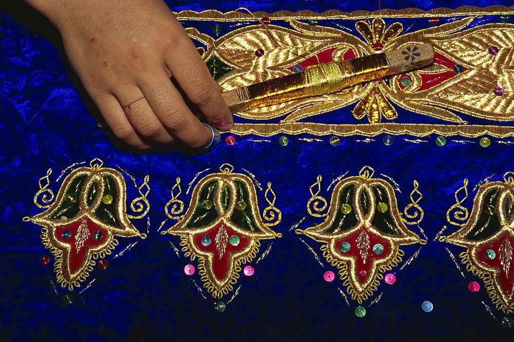 Detail of gold embroidery work in embroidery factory, Bukhara, Uzbekistan, Central Asia, Asia