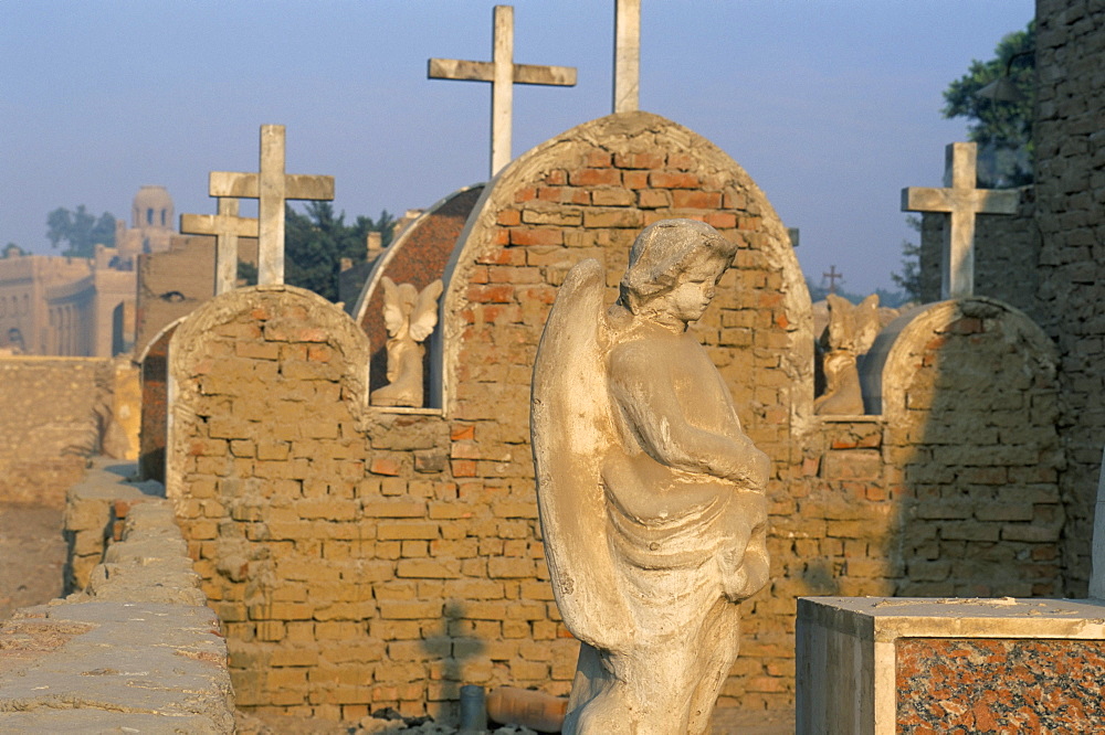 Angel and Christian tombs in Coptic cemetery, Old Cairo, Cairo, Egypt, North Africa, Africa