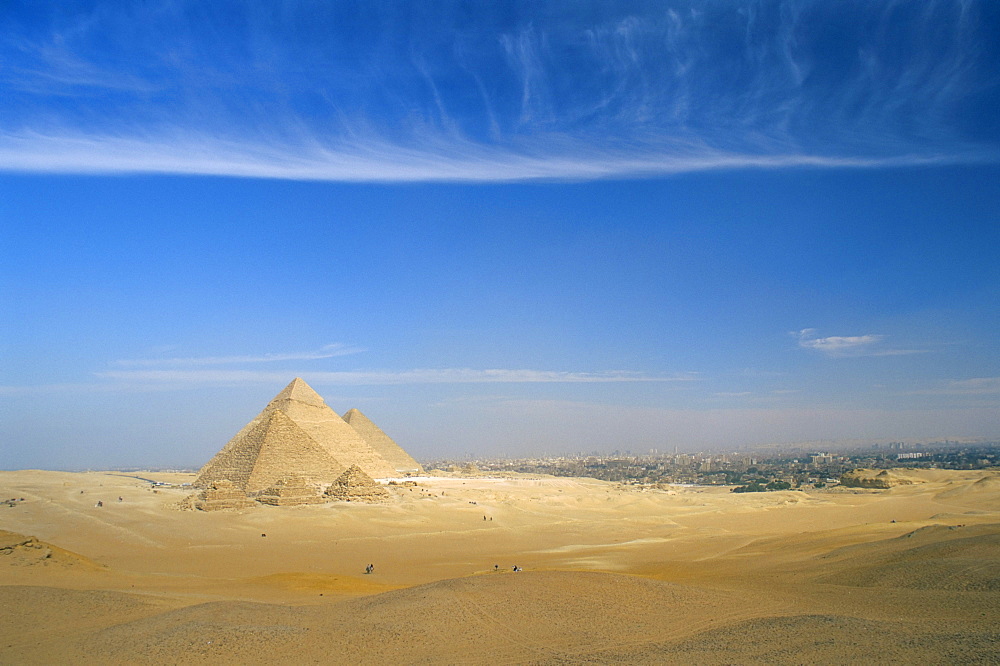 The Pyramids at Giza, UNESCO World Heritage Site, with Cairo in the background, Egypt, North Africa, Africa