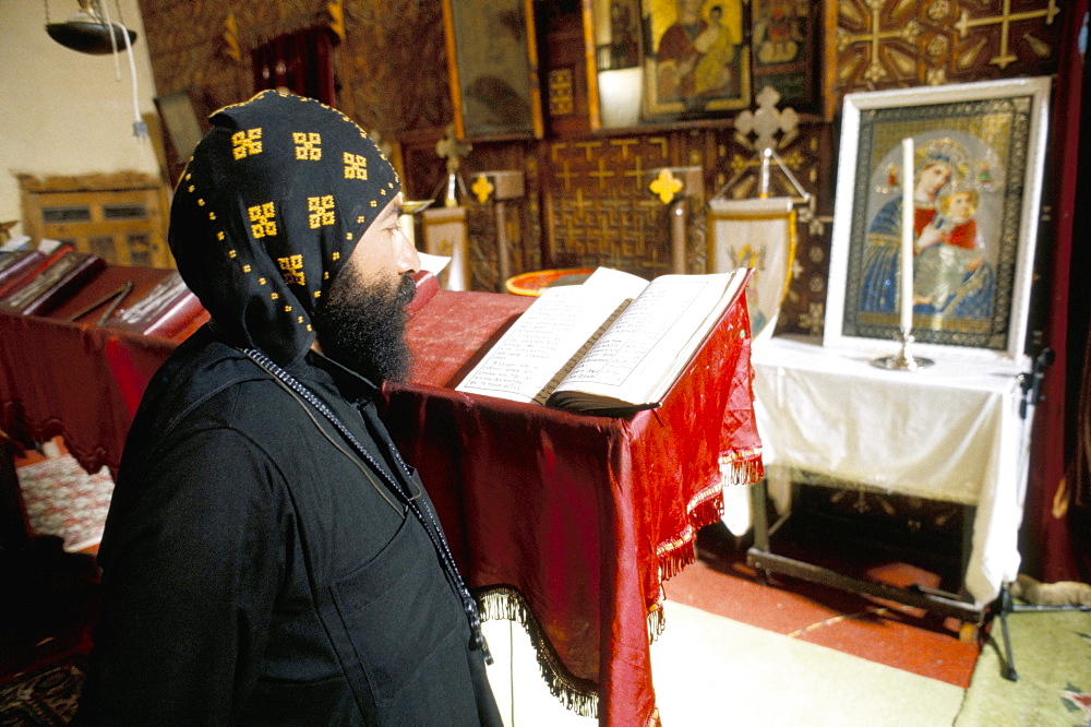 Studying in Apostles church, St. Antony's (St. Anthony's) Coptic monastery, Eastern Desert, Egypt, North Africa, Africa