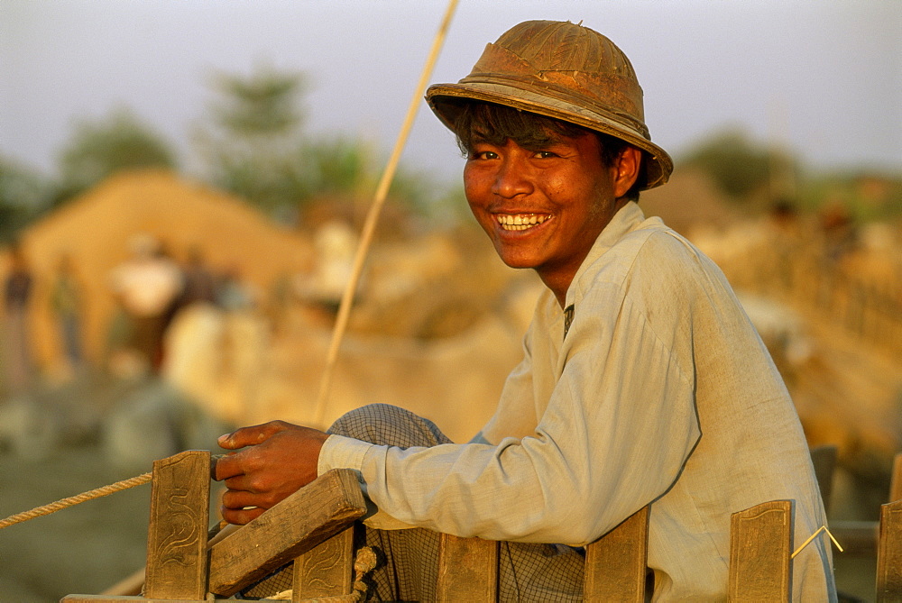 Portrait of a bullock cart driver at a government rice depot, near Bago (Pegu), Myanmar (Burma), Asia