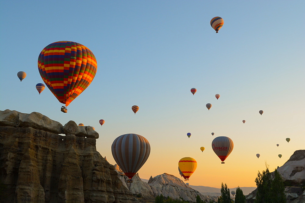 Hot air balloons cruising over Cappadocia, Anatolia, Turkey, Asia Minor, Eurasia