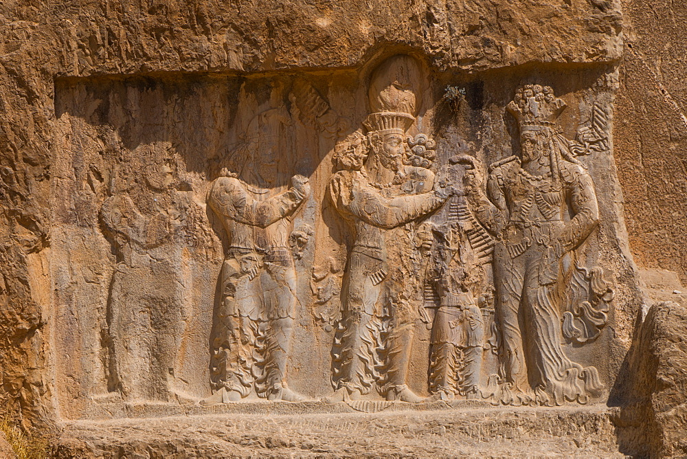 Carved relief of the Investiture of Narse, 294-302 AD, to the lower right of the Tomb of Darius the Great, Naqsh-e Rostam Necropolis, Iran, Middle East