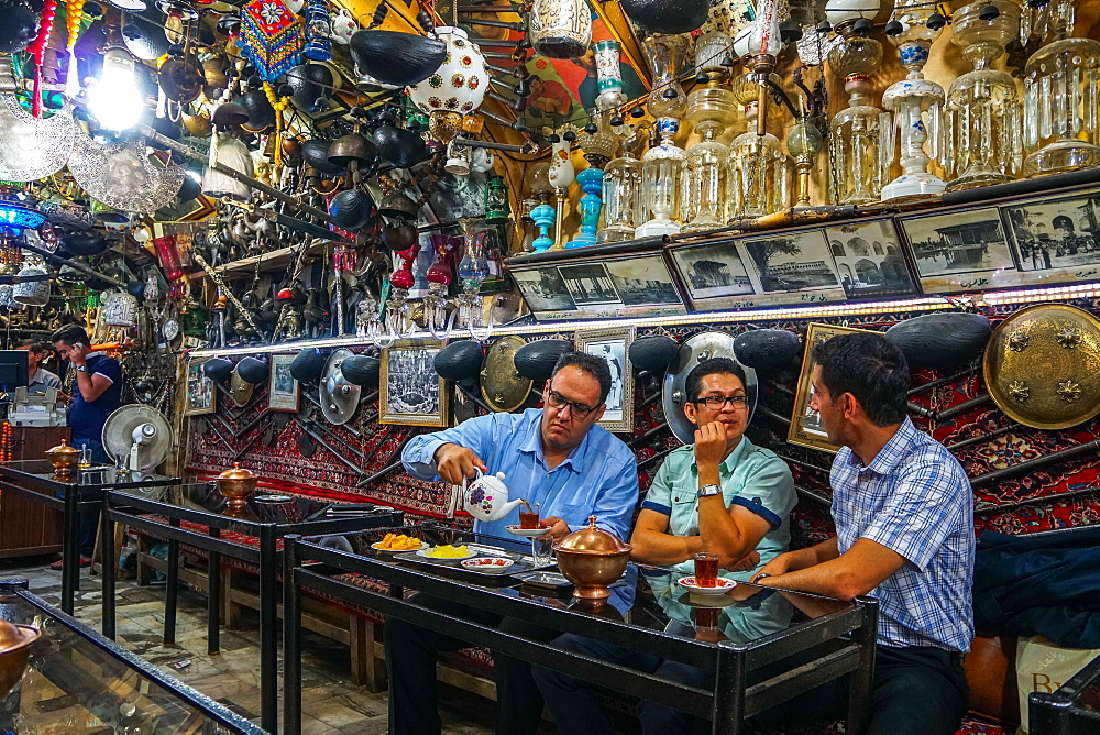 Bazaaris chatting after work, Azadegan Tea House, Isfahan, Iran, Middle East