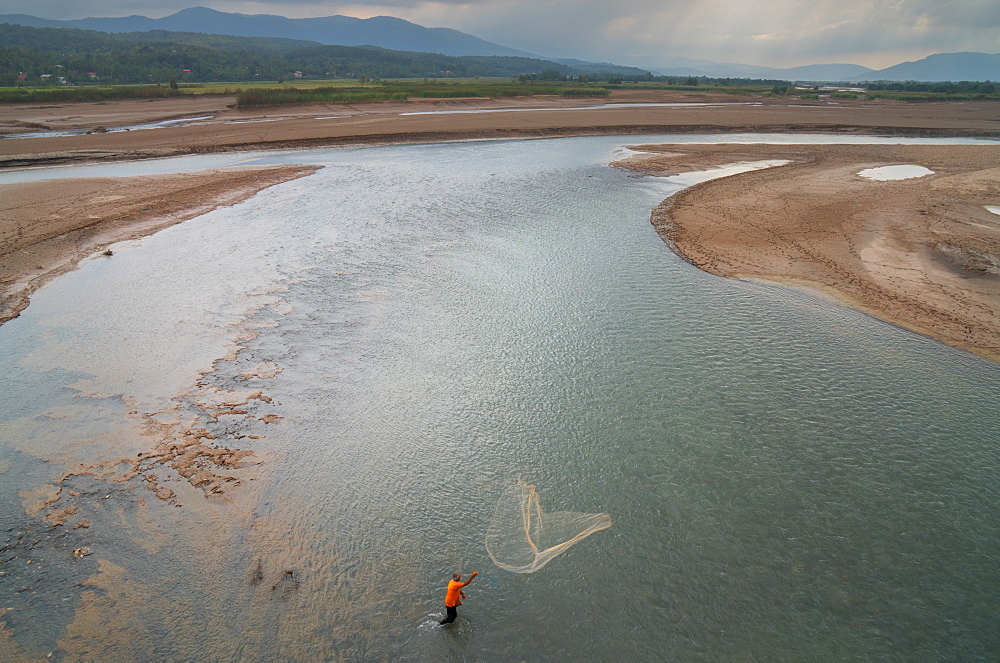 Fisherman casts his net, near Caspian Sea, Iran, Middle East