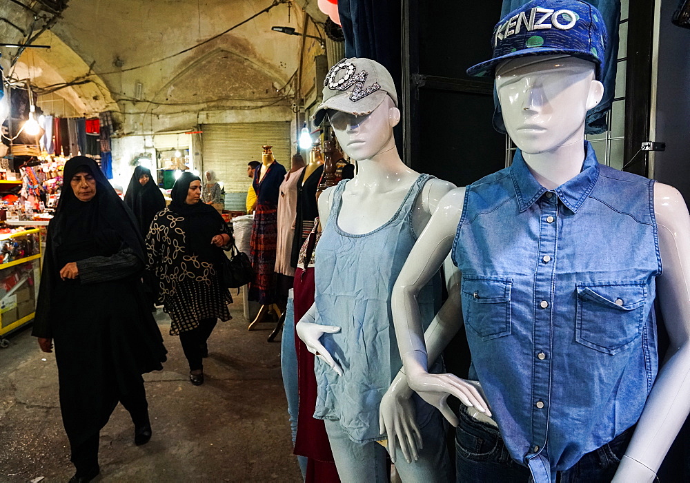 Modern dress competes with traditional dress, Grand Bazaar, Isfahan, Iran, Middle East