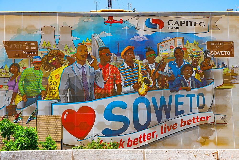 Public painted welcome and advertising sign of bank better, live better, on wall at entrance to Soweto (South Western Township), Johannesburg, South Africa, Africa