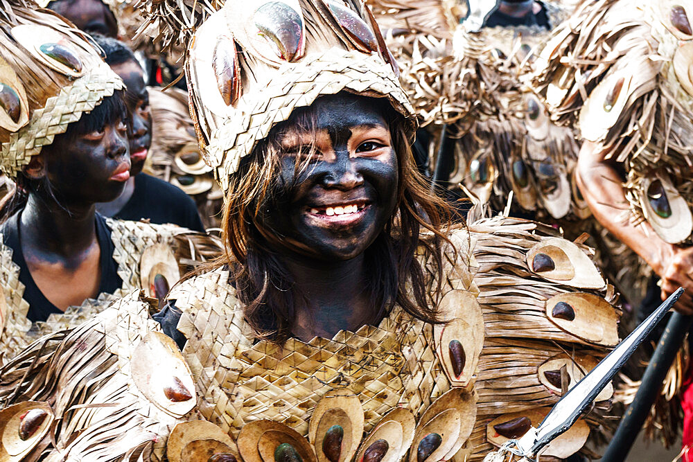 Woman with spear dressed as aboriginal tribeswoman marching at the annual Ati-Atihan Festival, Kalibo Island, Philippines, Southeast Asia, Asia