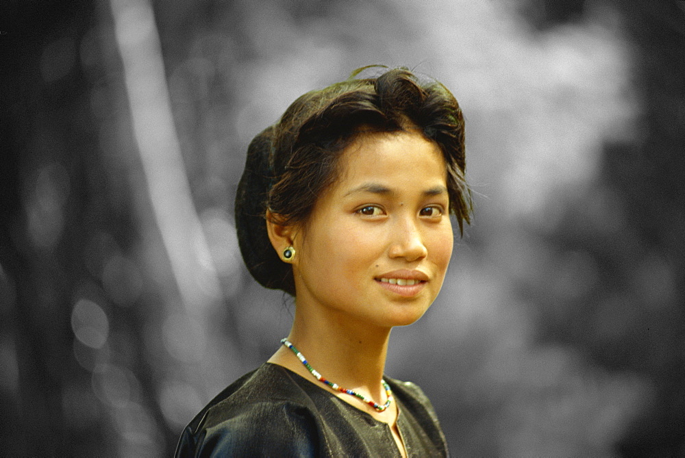 Tea girl, aged 13, at funeral, Sulawesi, Indonesia, Southeast Asia, Asia