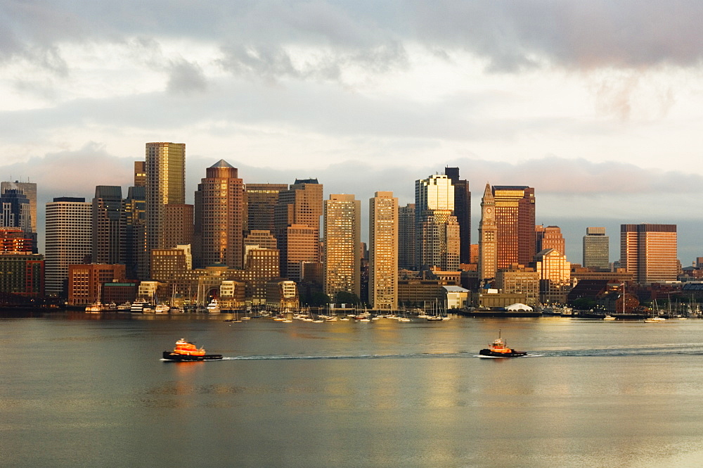 The skyline of the Financial District across Boston Harbor at dawn, Boston, Massachusetts, USA