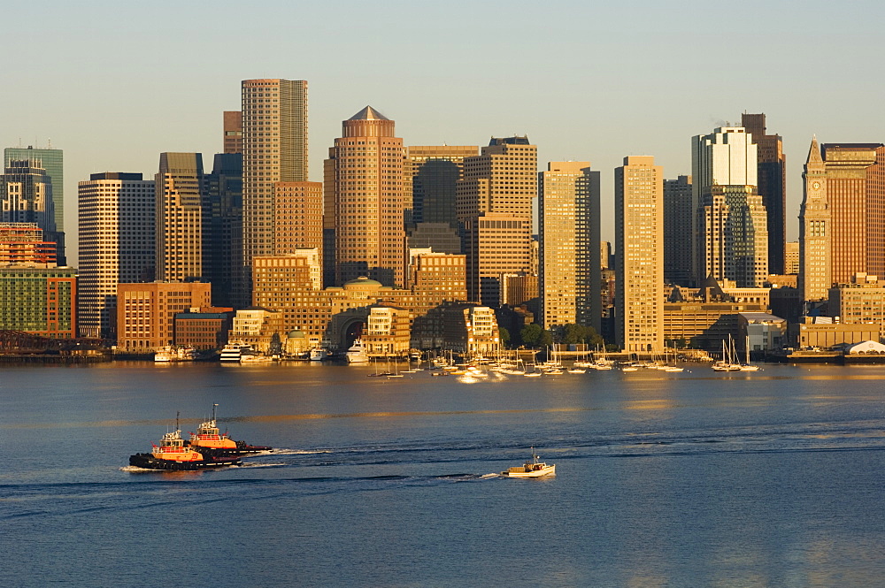 City skyline at dawn across Boston Harbor, Boston, Massachusetts, USA