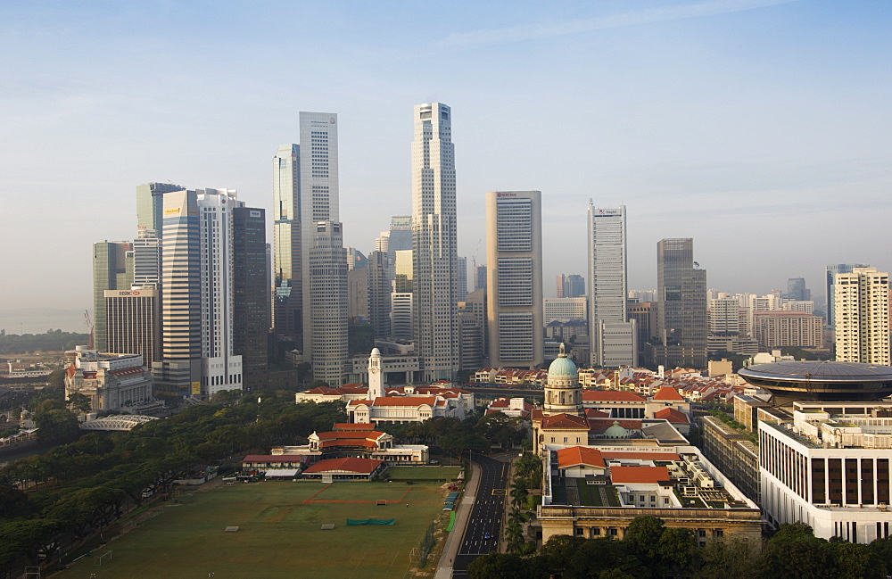 Singapore skyline with the Padang and Colonial District in the foreground, Singapore, South East Asia