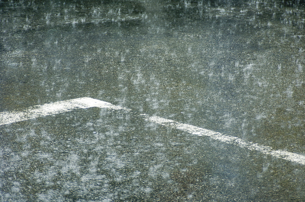 Heavy downpour of rain on a road