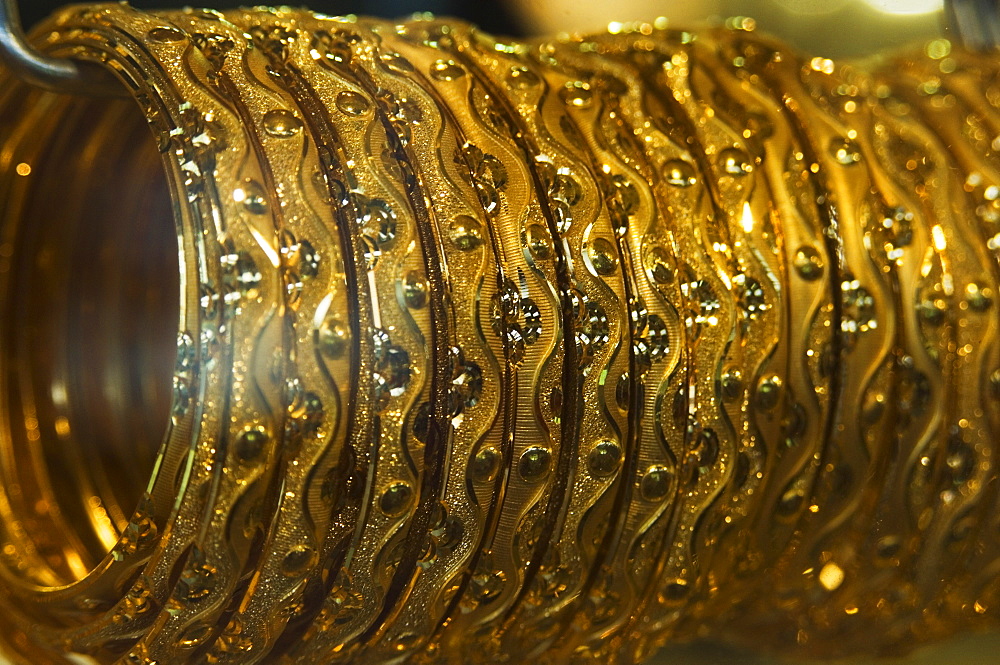 Close up of gold bangles on display, the Gold Souk, Deira, Dubai, United Arab Emirates, Middle East