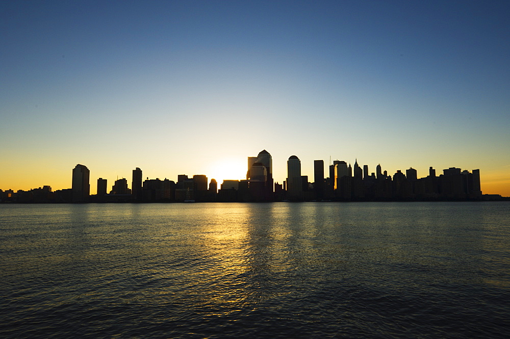 Lower Manhattan skyline at dawn across the Hudson River, New York City, New York, United States of America, North America