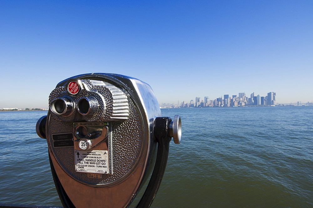 Coin operated binoculars, view of Manhattan skyline from Liberty Island, New York City, New York, United States of America, North America