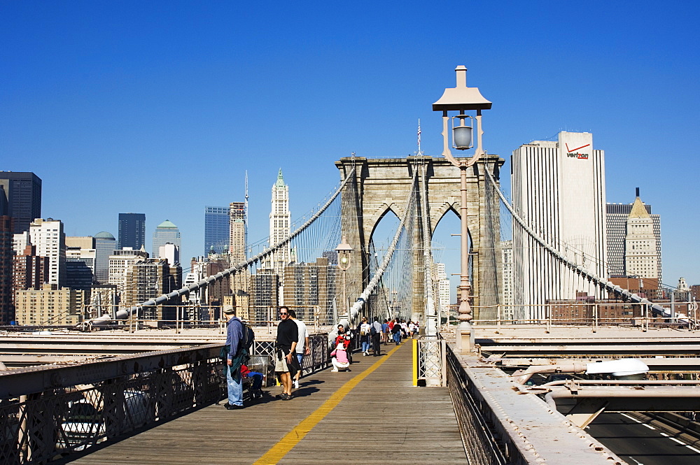 Pedestrian walkway on the Brooklyn Bridge looking towards Manhattan, New York City, New York, United States of America, North America