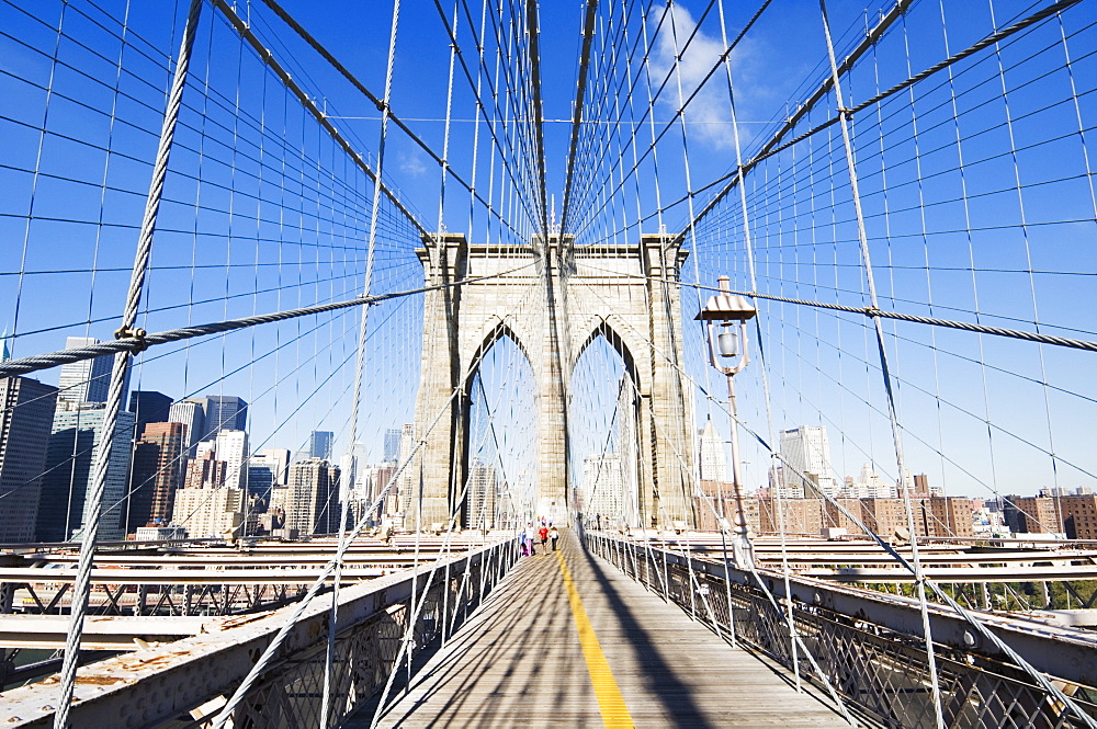 Pedestrian walkway on the Brooklyn Bridge looking towards Manhattan, New York City, New York, United States of America, North America