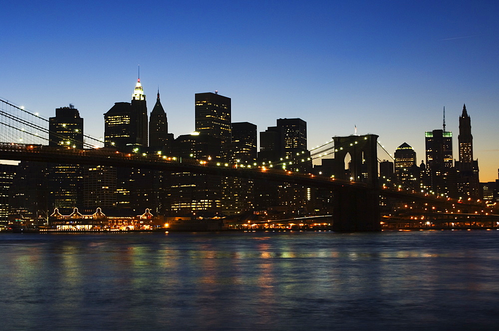 Manhattan skyline and Brooklyn Bridge at dusk, New York City, New York, United States of America, North America