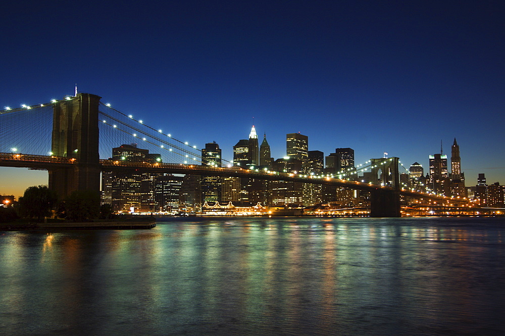 Manhattan skyline and Brooklyn Bridge at dusk, New York City, New York, United States of America, North America