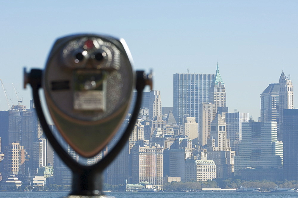 Coin operated binoculars facing Manhattan skyline, Liberty Island, New York City, New York, United States of America, North America