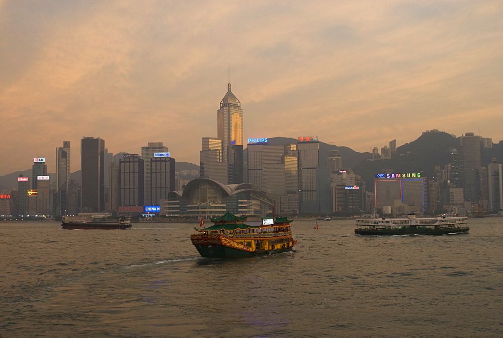 A Chinese style tourist boat sails in Victoria Harbour, Hong Kong, China, Asia