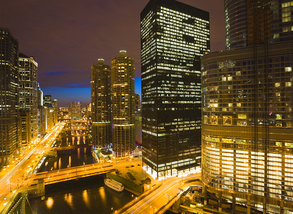 Buildings along Wacker Drive and the Chicago River at dusk, Marina City centre, Trump Tower on right, Chicago, Illinois, United States of America, North America