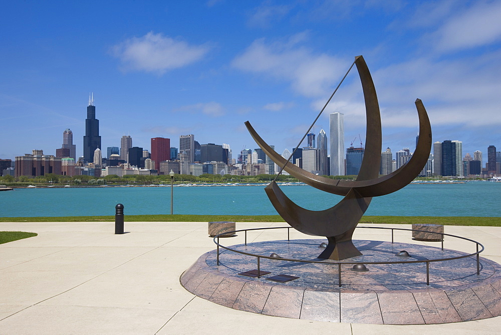 Sundial sculpture at the Adler Planetarium and city skyline, Chicago, Illinois, United States of America, North America