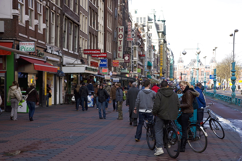 Damrak, a busy thoroughfare in the centre of the city, Amsterdam, Netherlands, Europe