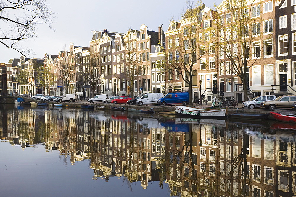 Houses reflecting in the Singel canal, Amsterdam, Netherlands, Europe