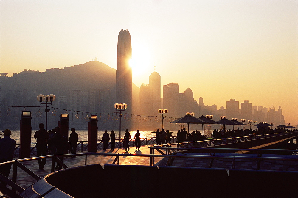 Avenue of Stars, Tsim Sha Tsui, Kowloon, with Victoria Harbour and skyline of Hong Kong Island in the background at dusk, Hong Kong, China, Asia