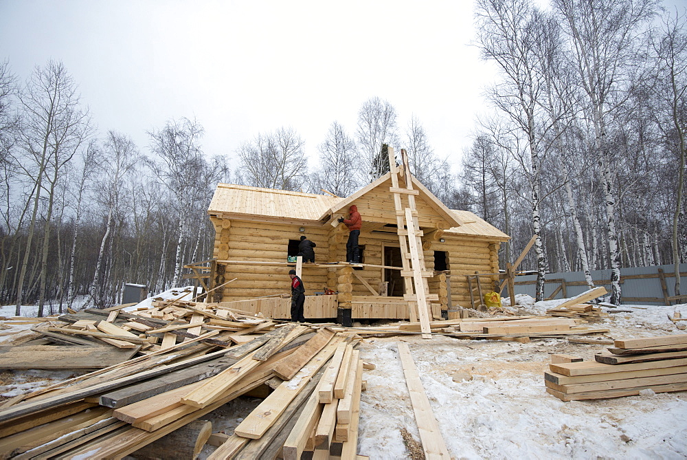 Building traditional wooden cabin in the Siberian Taiga forest, Irkutsk Oblast, Russia, Eurasia