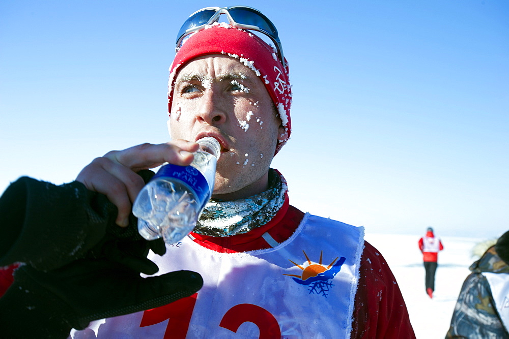 Cold runner in the 10th Baikal Ice Marathon, run on the frozen surface of the world's largest fresh water lake on 1st March 2014, Siberia, Irkutsk Oblast, Russia, Eurasia