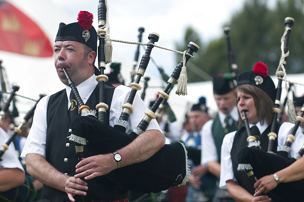 Pipers from the Dufftown and District Pipe band, Abernethy Highland Games held at Nethy Bridge Inverness shire, Scotland, United Kingdom, Europe