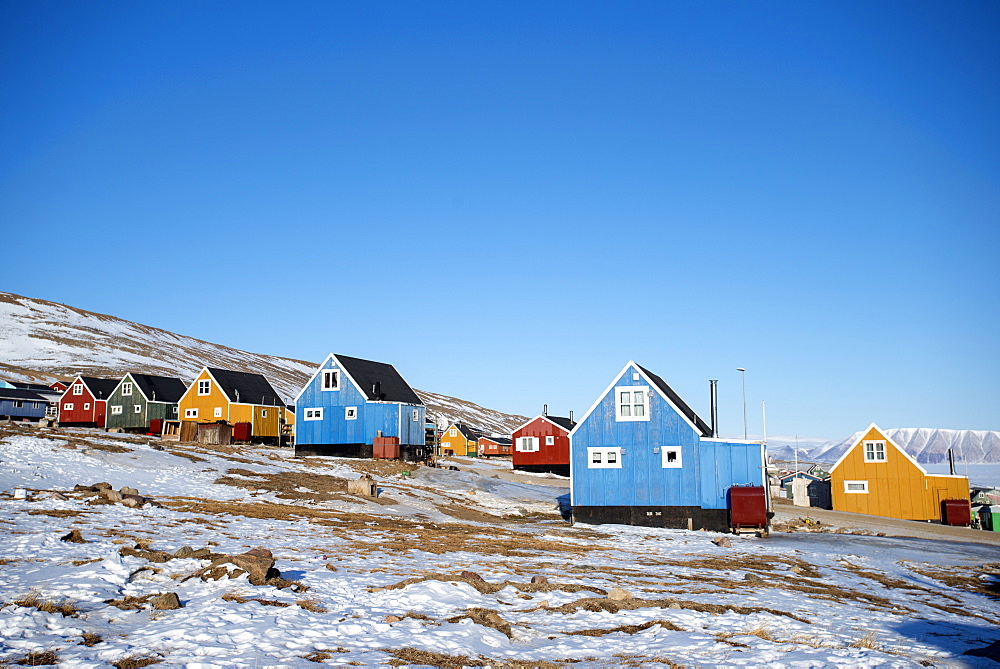 Colourful wooden houses in the village of Qaanaaq, one of the most northerly human settlements on the planet and home to 656 mostly Inuit people, Greenland, Denmark, Polar Regions