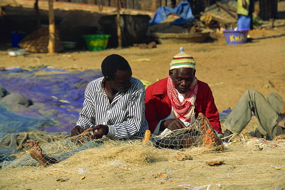 Net menders, fishing village, The Gambia, West Africa, Africa