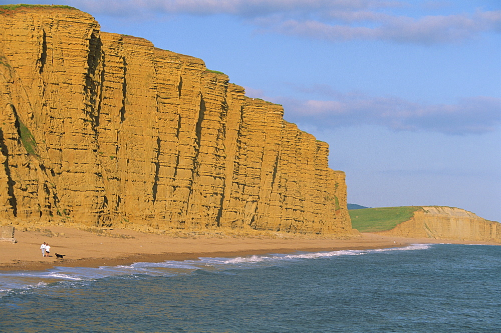 Cliffs towering over West Bay Beach, Dorset, England, United Kingdom, Europe