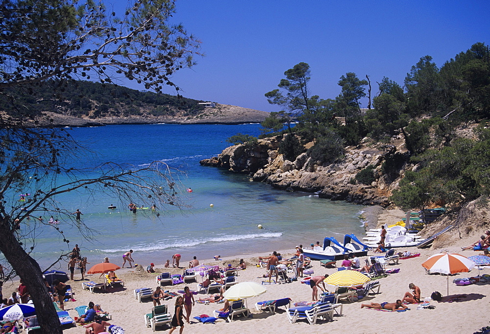 Crowded beach at Portinatx, Ibiza, Baleares, (Spain)