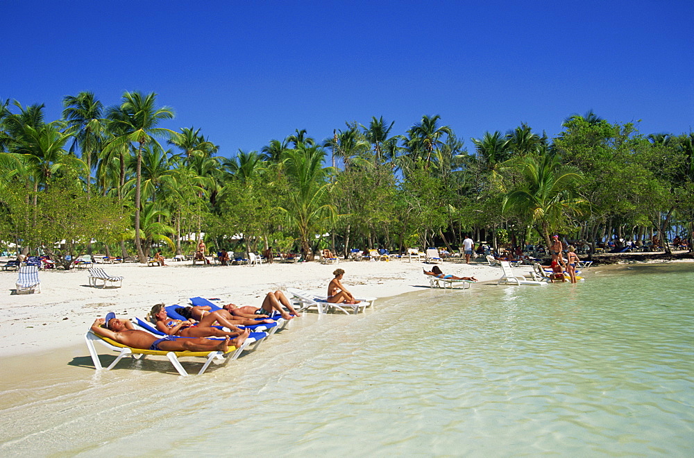 Tourists on beach, Punta Cana, Dominican Republic, West Indies, Caribbean, Central America