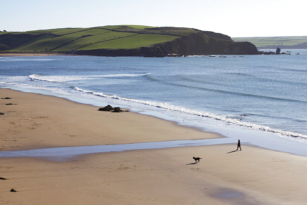 Walker on beach, Bigbury on Sea, Devon, England, United Kingdom, Europe