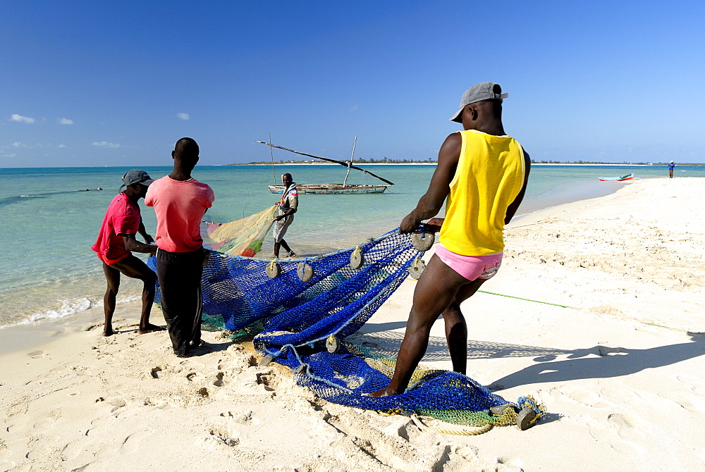 Fishermen pulling in net, Pangane Beach, Mozambique, Africa